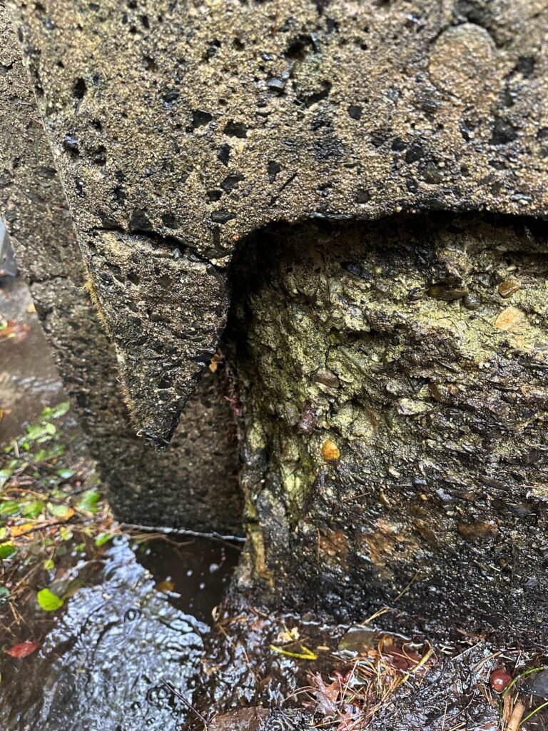 Closeup of damaged corner of the dam